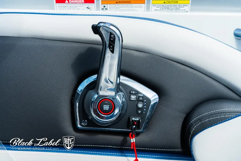Slide: The Image of Throttle control of 2024 Crownline 260 XSS boat with sleek design and safety features. - 19