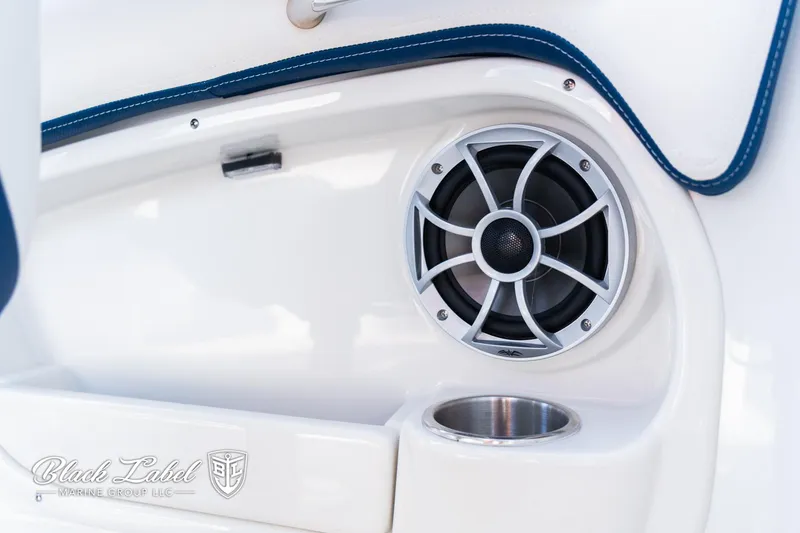 Slide: The Image of 2024 Crownline 260 XSS boat interior with speaker and cup holder. - 26