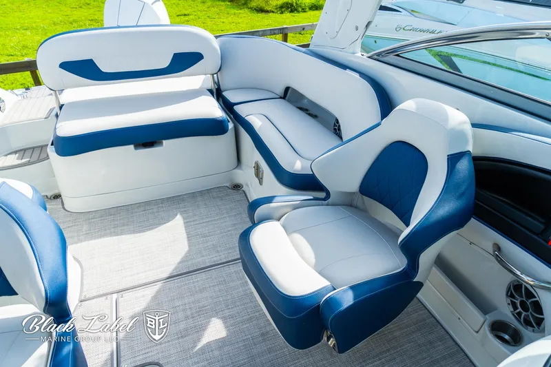 Slide: The Image of 2024 Crownline 260 XSS boat interior with blue and white seating. - 27