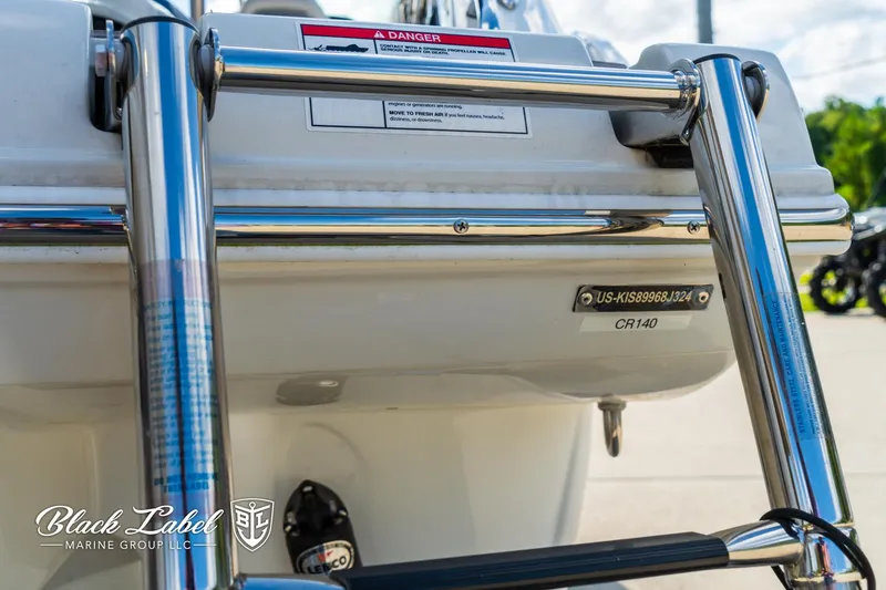 Slide: The Image of 2024 Crownline 260 XSS boat ladder and stern details, featuring Black Label Marine Group branding. - 3