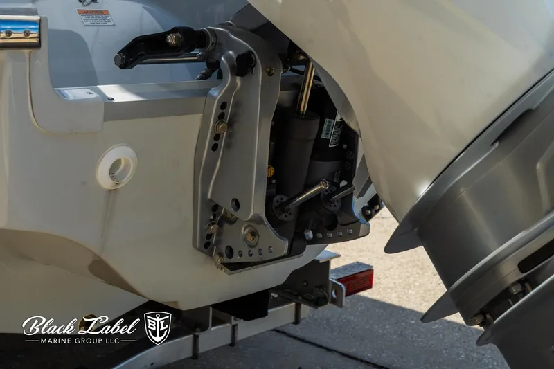 Slide: The Image of 2024 Crownline 260 XSS boat engine detail, featuring Black Label Marine Group branding. - 6