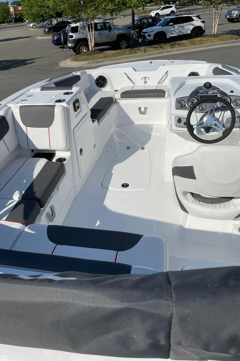 Slide: The Image of 2024 Tahoe 1950 boat interior with seating and steering wheel. - 3