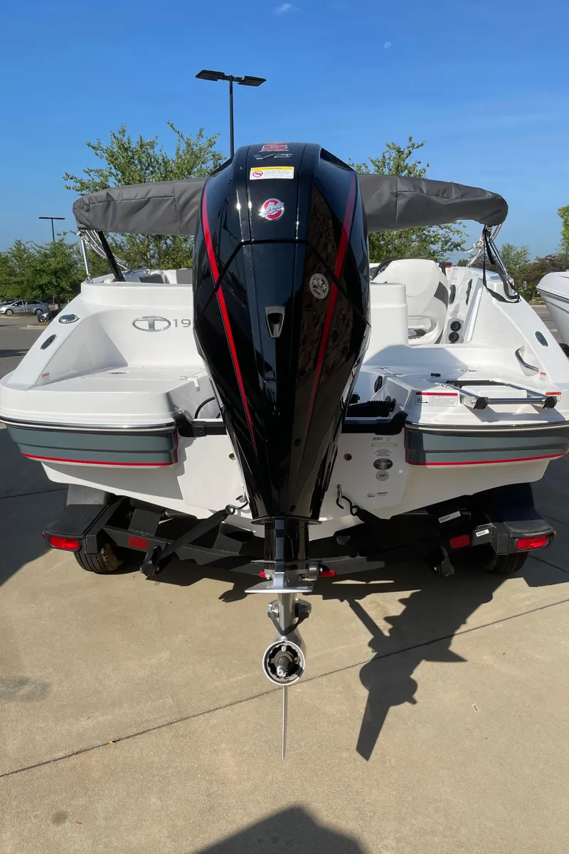 Slide: The Image of 2024 Tahoe 1950 boat with outboard motor, rear view. - 5