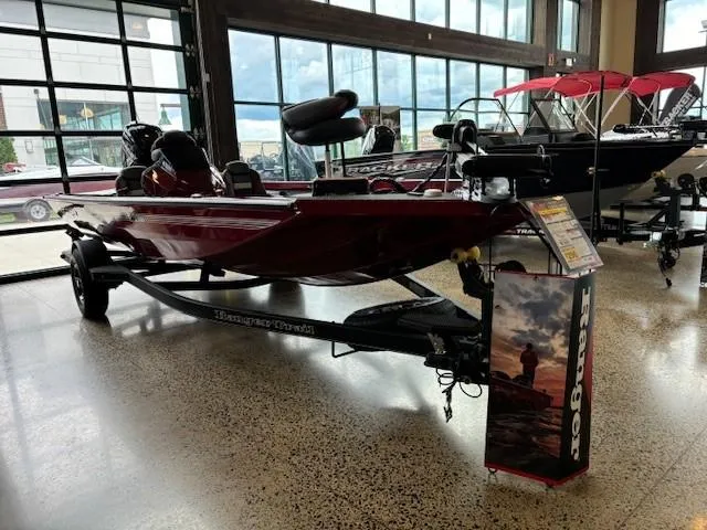 Slide: The Image of 2024 Ranger RT178 boat on display in showroom. - 1