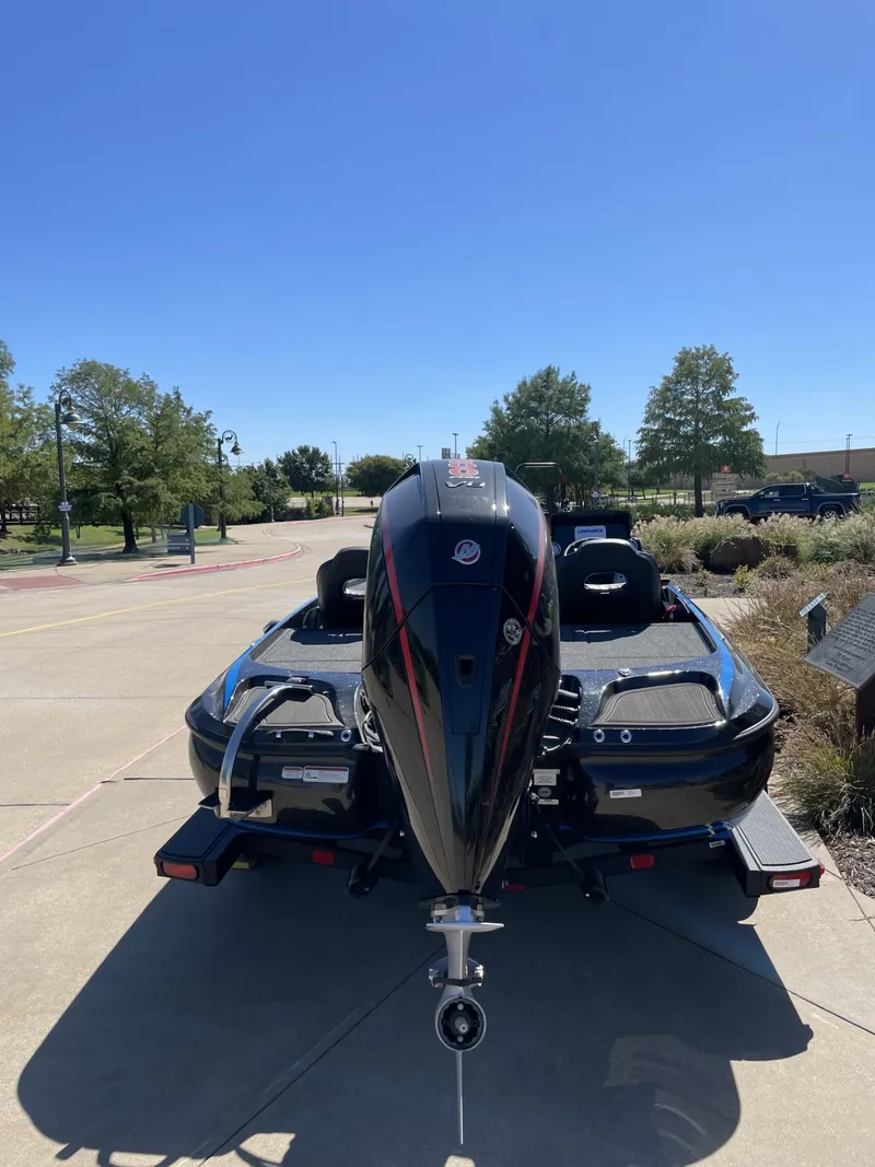 Slide: The Image of 2024 Nitro Z19 boat with powerful outboard motor, parked outdoors. - 5