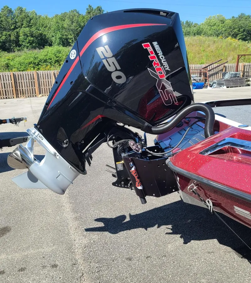 Slide: The Image of 2024 Ranger Z521R boat with Mercury Pro XS 250 engine, parked outdoors. - 3