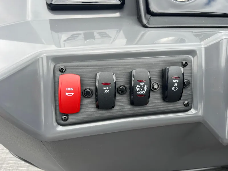 Slide: The Image of Control panel of the 2024 Bennington 188 SVL boat with various switches. - 10