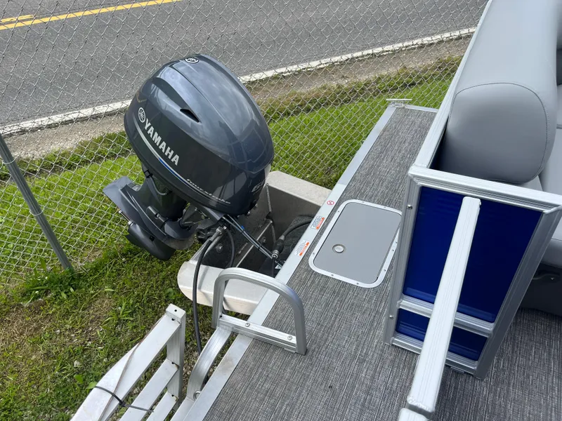 Slide: The Image of 2024 Bennington 188 SVL pontoon boat with Yamaha outboard motor. - 12