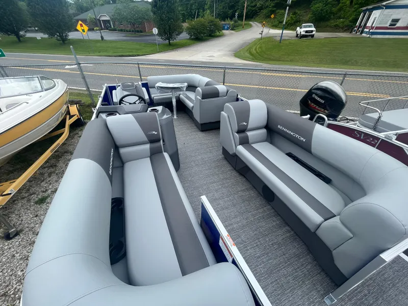 Slide: The Image of 2024 Bennington 188 SVL pontoon boat with spacious seating and modern design. - 2