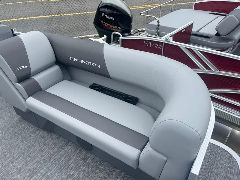 Slide: The Image of 2024 Bennington 188 SVL pontoon boat with gray and white seating. - 3