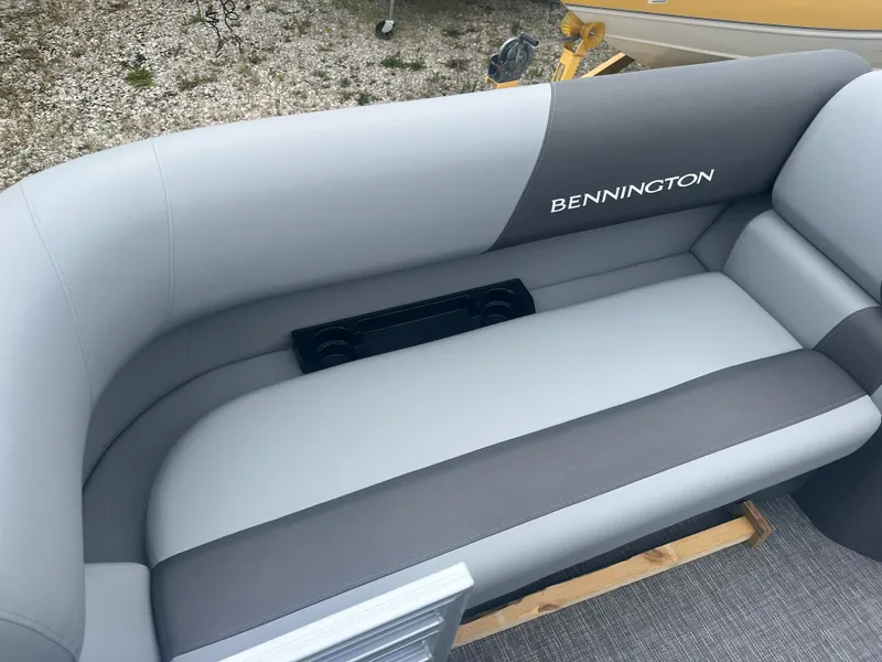 Slide: The Image of 2024 Bennington 188 SVL boat interior seating with gray and black upholstery. - 4