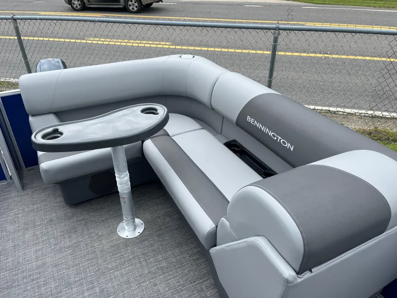 Slide: The Image of 2024 Bennington 188 SVL boat interior with gray seating and table. - 5