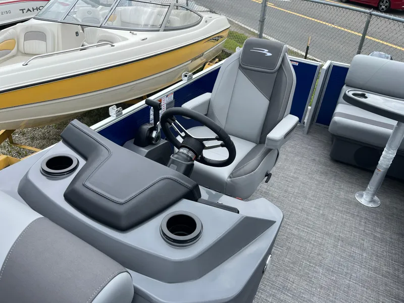 Slide: The Image of 2024 Bennington 188 SVL boat interior with steering console and seating. - 6