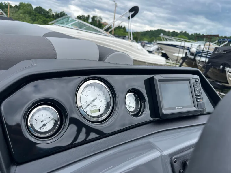 Slide: The Image of Dashboard of 2024 Bennington 188 SVL boat with gauges and Garmin display. - 8