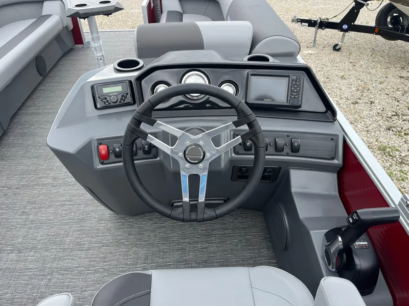 Slide: The Image of 2024 Bennington 20 SVSR boat dashboard with steering wheel and control panel. - 12