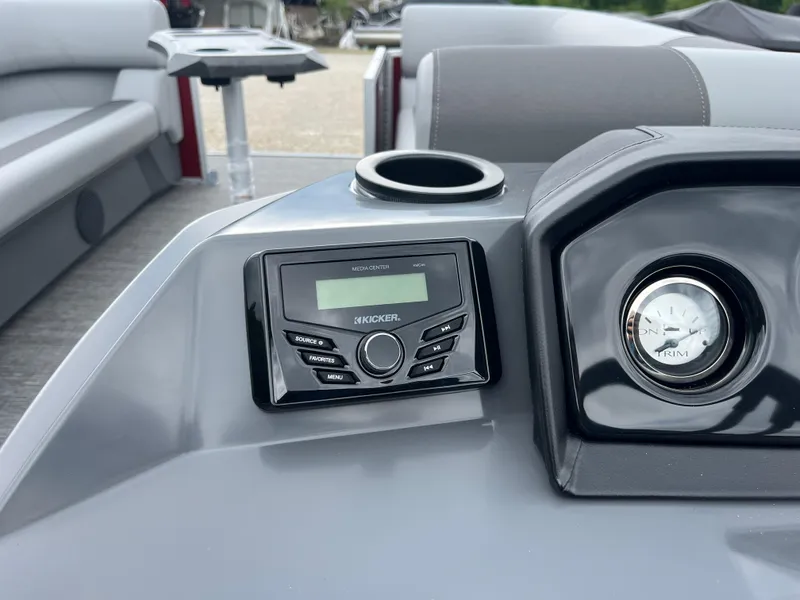 Slide: The Image of 2024 Bennington 20 SVSR boat dashboard with Kicker stereo and cup holder. - 15