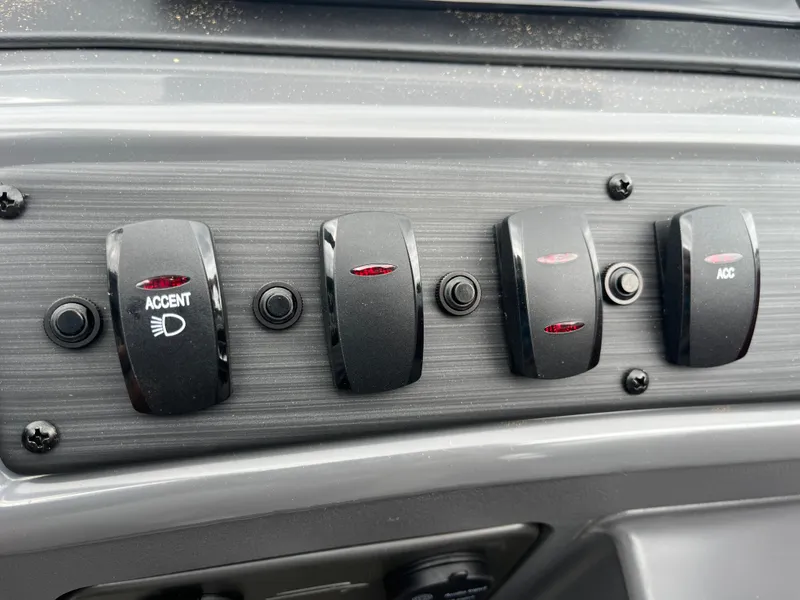Slide: The Image of Control panel switches of a 2024 Bennington 20 SVSR boat. - 17