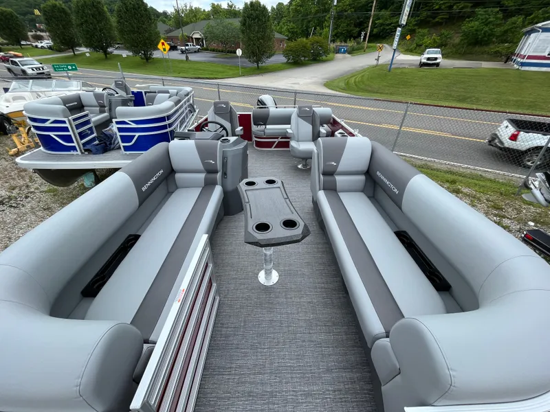 Slide: The Image of 2024 Bennington 20 SVSR pontoon boat with spacious seating and cup holders. - 4