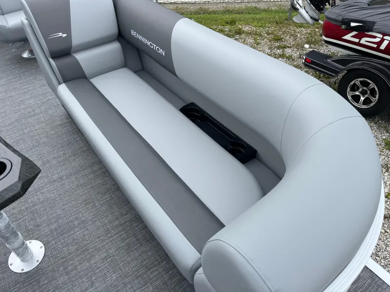 Slide: The Image of 2024 Bennington 20 SVSR boat interior with gray seating and cup holders. - 6