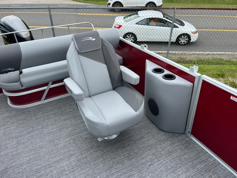 Slide: The Image of 2024 Bennington 20 SVSR boat interior with gray captain's chair and cup holders. - 8