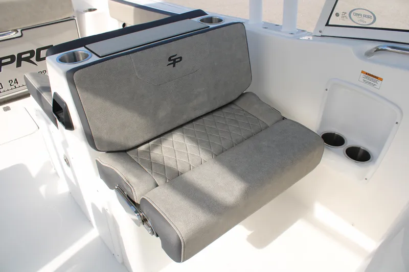 Slide: The Image of 2024 Sea Pro 240 boat seat with cup holders and storage. - 16