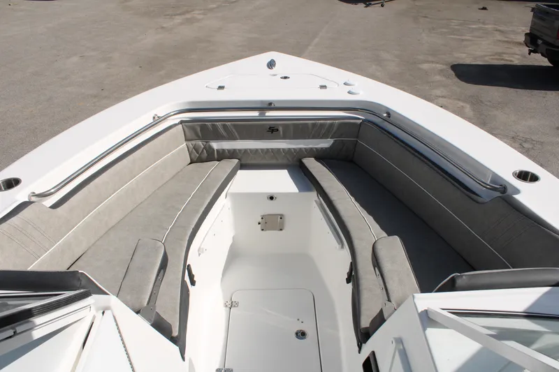 Slide: The Image of 2024 Sea Pro 240 boat with spacious seating and storage compartments. - 25