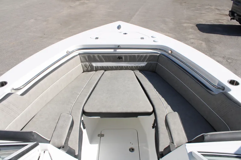 Slide: The Image of 2024 Sea Pro 240 boat with spacious bow seating and cushioned lounge area. - 28