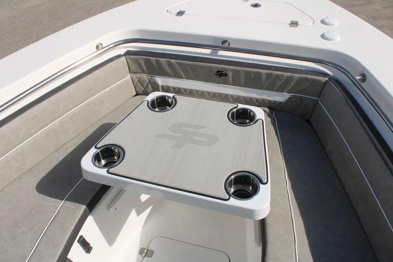 Slide: The Image of 2024 Sea Pro 240 boat interior with cushioned seating and table. - 29