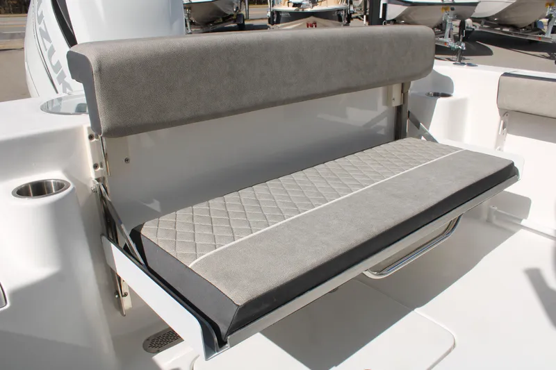 Slide: The Image of 2024 Sea Pro 240 boat with cushioned seating and stainless steel cup holders. - 7