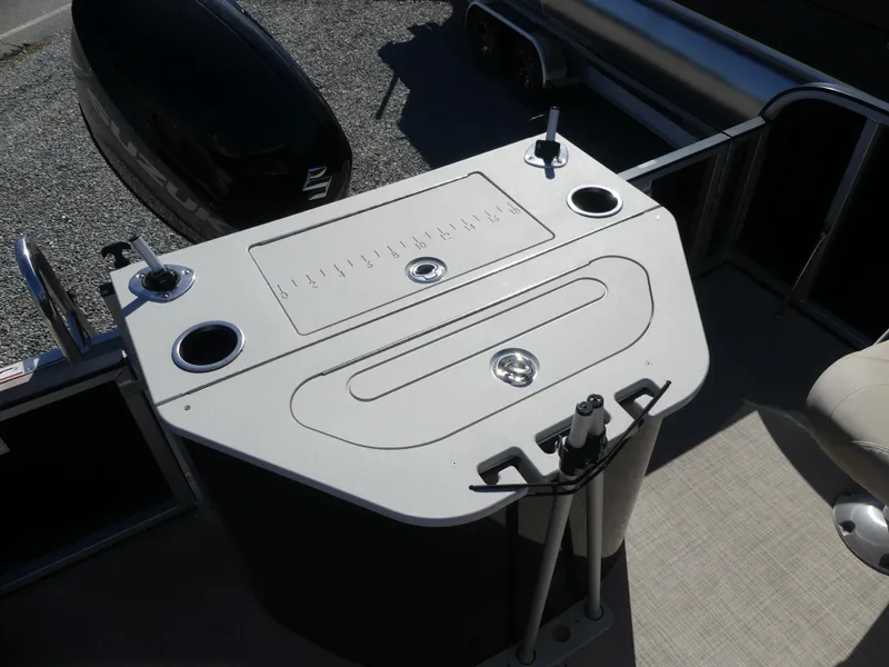 Slide: The Image of 2023 Silver Wave 2410 SW3 RLP boat deck with integrated cup holders and storage compartments. - 13