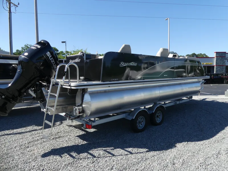 Slide: The Image of 2023 Silver Wave 2410 SW3 RLP pontoon boat on a trailer. - 2