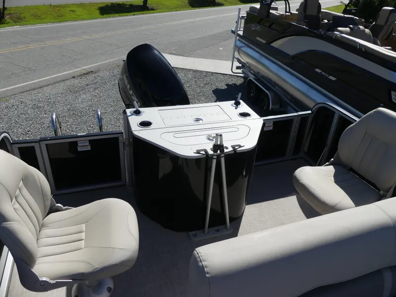 Slide: The Image of 2023 Silver Wave 2410 SW3 RLP boat interior with seating and control console. - 5