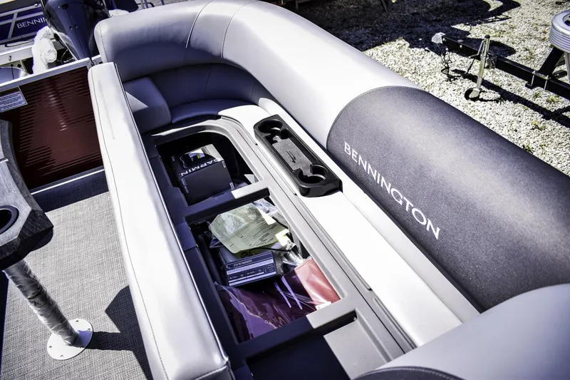Slide: The Image of 2024 Bennington 22 SVSB pontoon boat with open storage compartment. - 10
