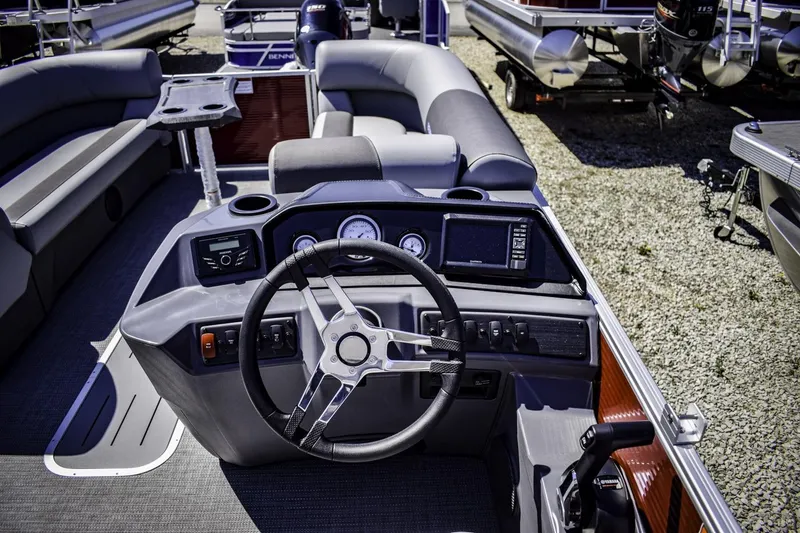 Slide: The Image of 2024 Bennington 22 SVSB pontoon boat interior with steering console and seating. - 13