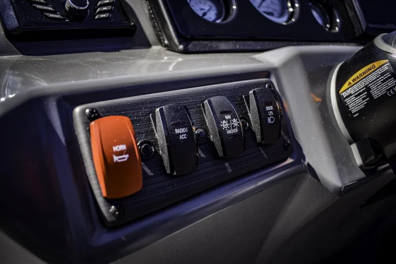 Slide: The Image of Control panel of a 2024 Bennington 22 SVSB boat with switches and gauges. - 17