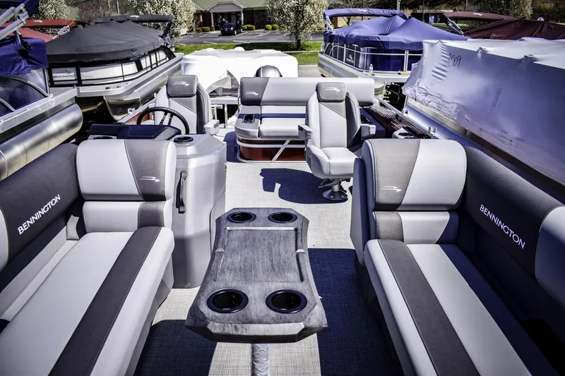 Slide: The Image of 2024 Bennington 22 SVSB pontoon boat interior with luxurious seating and table. - 4