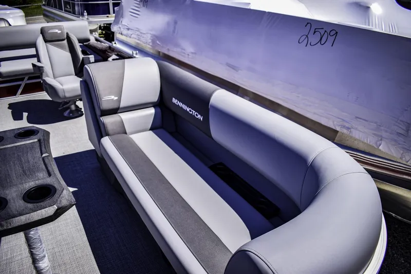 Slide: The Image of 2024 Bennington 22 SVSB boat interior with grey seating and cup holders. - 6