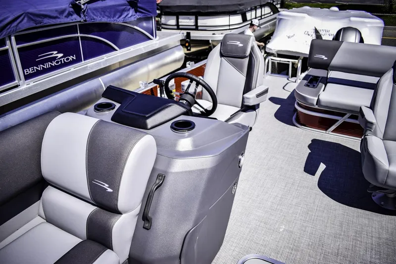Slide: The Image of 2024 Bennington 22 SVSB pontoon boat interior with helm and seating. - 7