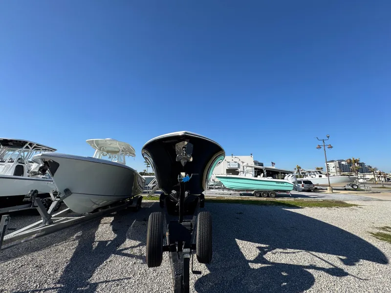 Slide: The Image of 2019 Blackwater 43SF boat on trailer, surrounded by other boats, under clear blue sky. - 12