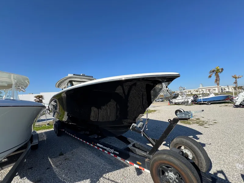 Slide: The Image of Blackwater 43SF 2019 boat on trailer under clear blue sky. - 13