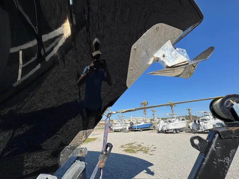 Slide: The Image of Close-up of a 2019 Blackwater 43SF boat hull with propeller, in a sunny marina. - 14