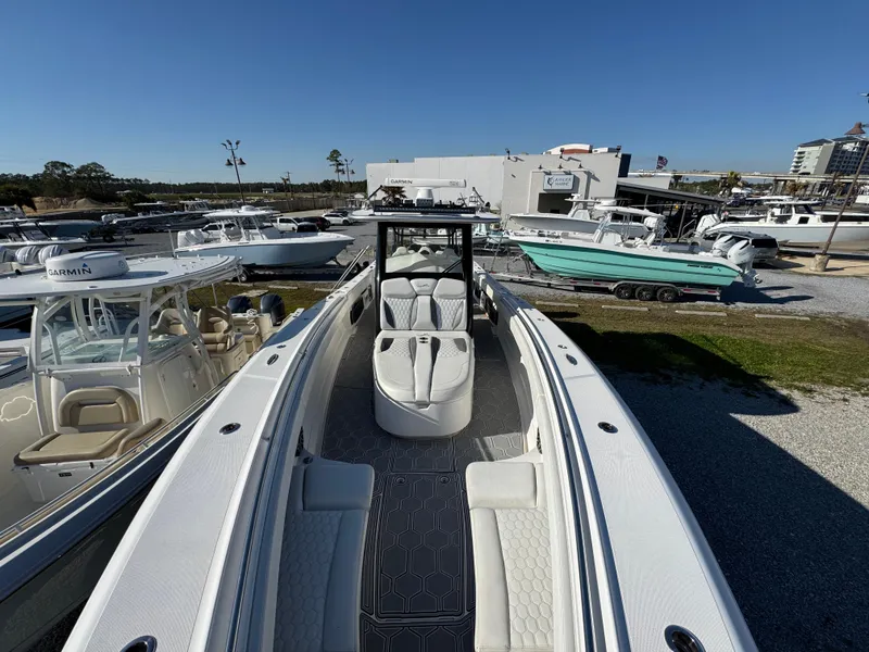Slide: The Image of Blackwater 43SF 2019 boat in marina, surrounded by other vessels under clear blue sky. - 17