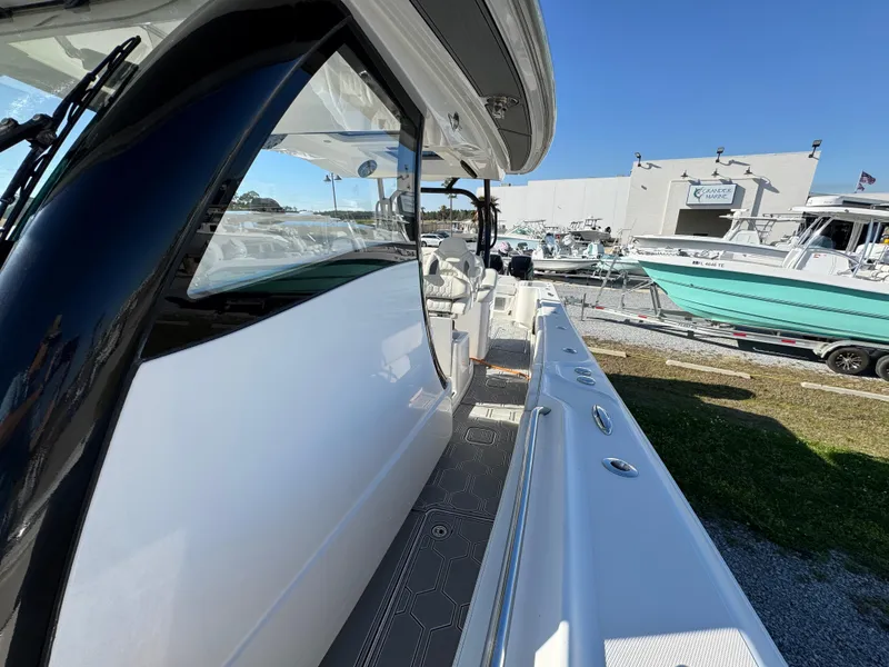 Slide: The Image of 2019 Blackwater 43SF boat, side view, docked at marina under clear blue sky. - 21