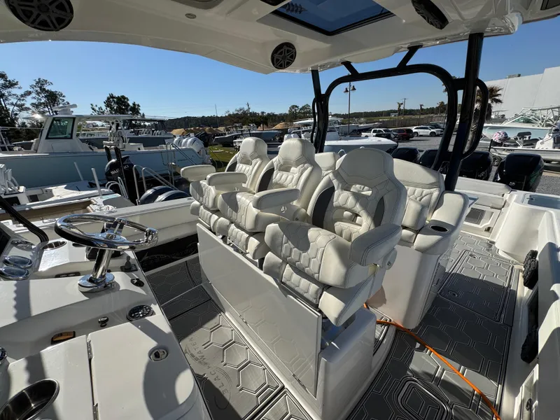 Slide: The Image of 2019 Blackwater 43SF boat interior with luxurious white seating and modern helm controls. - 28