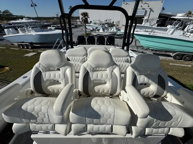 Slide: The Image of Luxurious seating on a 2019 Blackwater 43SF boat, featuring elegant white upholstery. - 29
