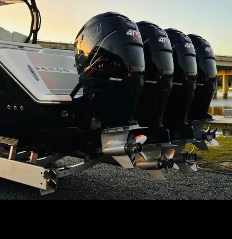 Slide: The Image of Four powerful Mercury outboard engines on a 2019 Blackwater 43SF boat at sunset. - 41