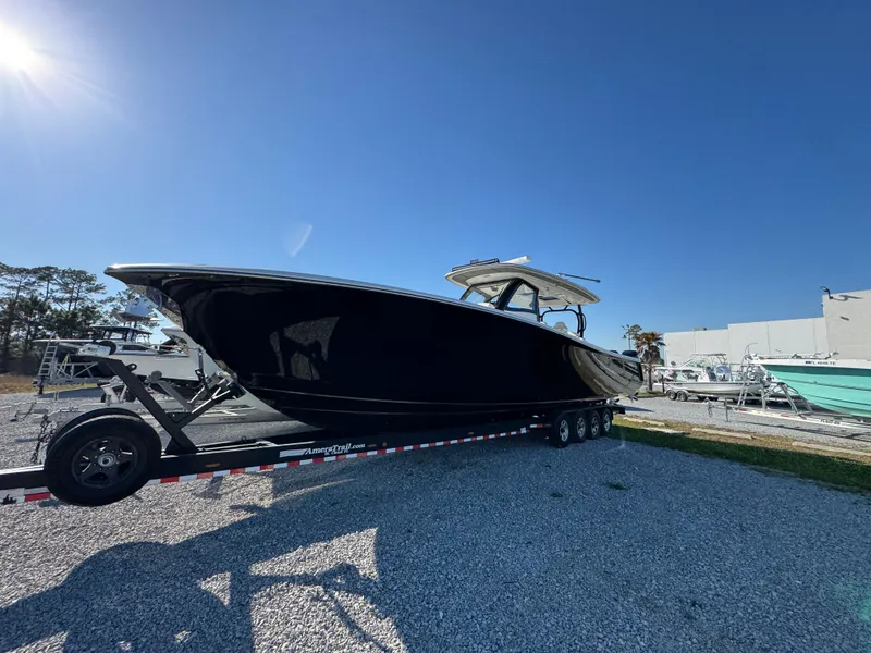 Slide: The Image of 2019 Blackwater 43SF boat on trailer under clear blue sky. - 5