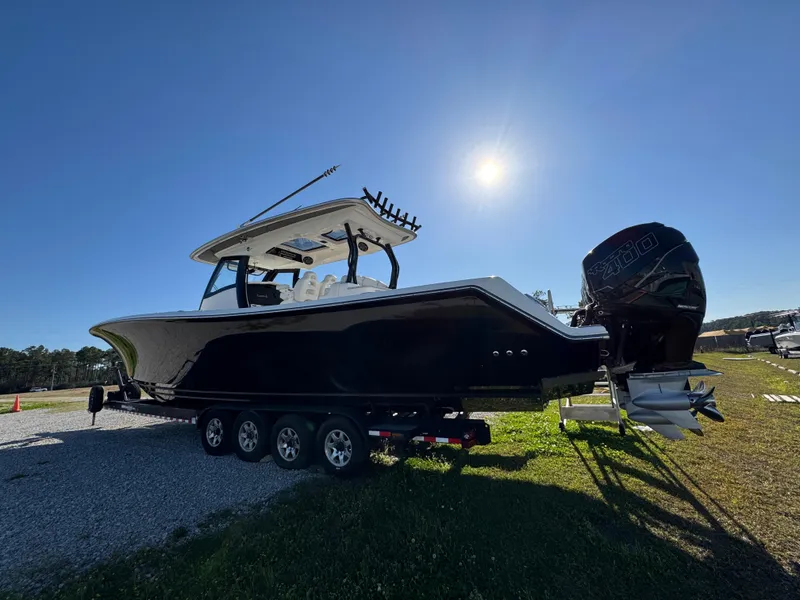Slide: The Image of 2019 Blackwater 43SF boat on trailer under bright sun. - 7