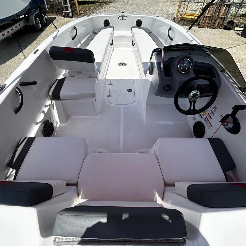 Slide: The Image of 2022 Tahoe T18 boat interior with seating and steering console. - 13