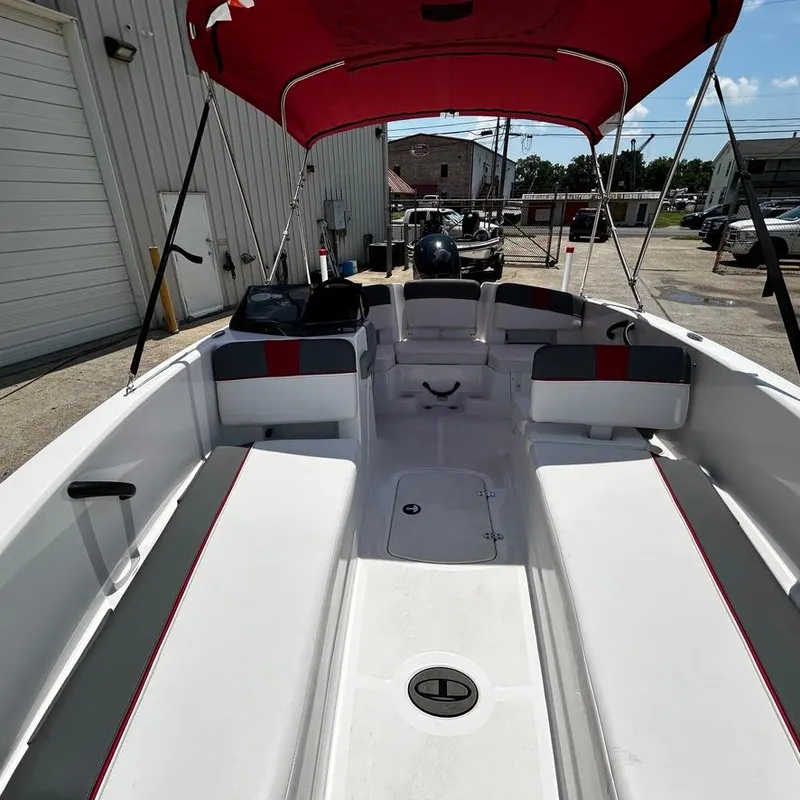 Slide: The Image of 2022 Tahoe T18 boat with red canopy and spacious seating. - 16